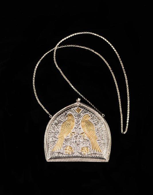 Front profile of the sculptural Paan Bag showcasing the weight and solid brass construction.